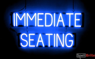 IMMEDIATE SEATING sign, featuring LED lights that look like neon IMMEDIATE SEATING signs