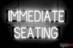 IMMEDIATE SEATING sign, featuring LED lights that look like neon IMMEDIATE SEATING signs