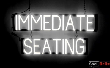 IMMEDIATE SEATING sign, featuring LED lights that look like neon IMMEDIATE SEATING signs