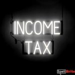 INCOME TAX sign, featuring LED lights that look like neon INCOME TAX signs