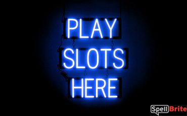 PLAY SLOTS HERE sign, featuring LED lights that look like neon PLAY SLOTS HERE signs