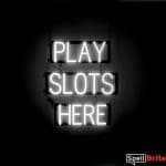 PLAY SLOTS HERE sign, featuring LED lights that look like neon PLAY SLOTS HERE signs