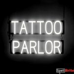 TATTOO PARLOR sign, featuring LED lights that look like neon TATTOO PARLOR signs