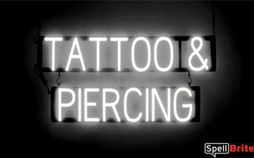 TATTOO PIERCING sign, featuring LED lights that look like neon TATTOO PIERCING signs