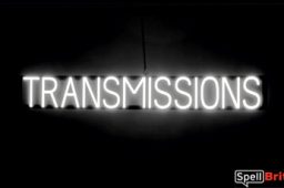 TRANSMISSIONS sign, featuring LED lights that look like neon TRANSMISSION signs