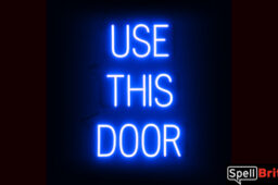 USE THIS DOOR sign, featuring LED lights that look like neon USE THIS DOOR signs