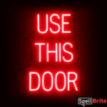 USE THIS DOOR sign, featuring LED lights that look like neon USE THIS DOOR signs