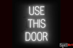 USE THIS DOOR sign, featuring LED lights that look like neon USE THIS DOOR signs