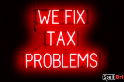 WE FIX TAX PROLEMS sign, featuring LED lights that look like neon WE FIX TAX PROLEMS signs