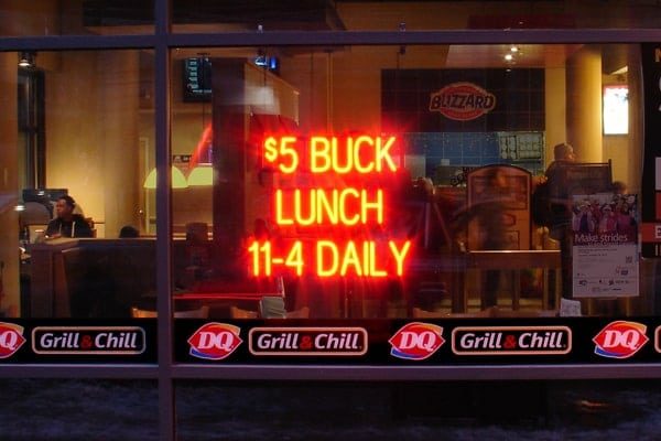 Custom restaurant sign that says “$5 Buck Lunch 11-4 Daily.”