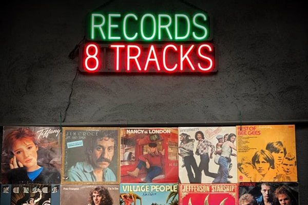 Custom neon LED sign featuring “Records 8 Tracks.”