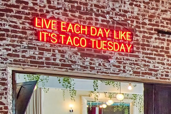 – Funny custom sign telling customers to “Live Every Day Like It’s Taco Tuesday.”