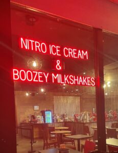 BOOZEY MILKSHAKES sign, featuring LED lights that look like neon BOOZEY MILKSHAKES signs